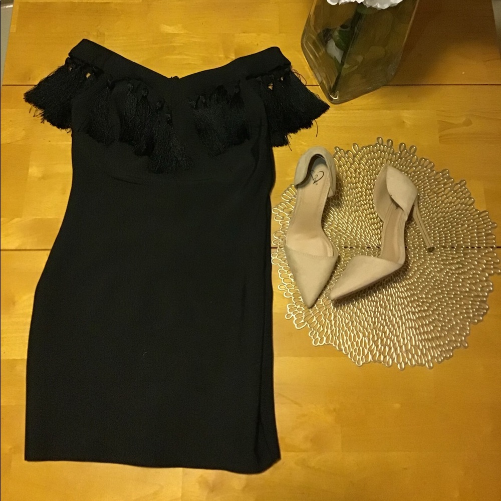 Black off the shoulders dress.